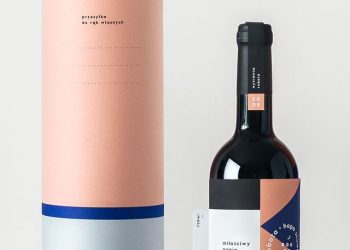 one paper tube packaging with a pink and white label with a bottle of wine next to it